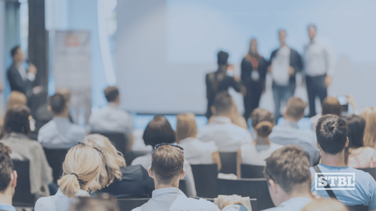 Business owners pitching in front of an audience