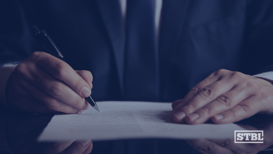 Signing contracts as a business owner.